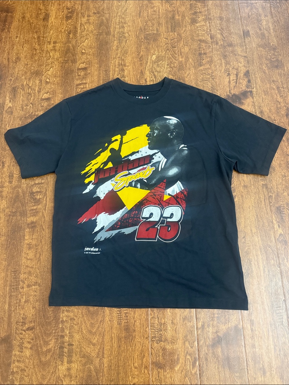 Jordan Black Graphic Tee with Red & Yellow Accents